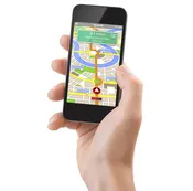 Stock photograph of a model: a hand holding a smartphone that shows turn-by-turn map directions